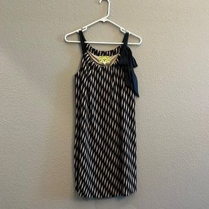 Anthropology midi dress with a Black and Tan geometric pattern.